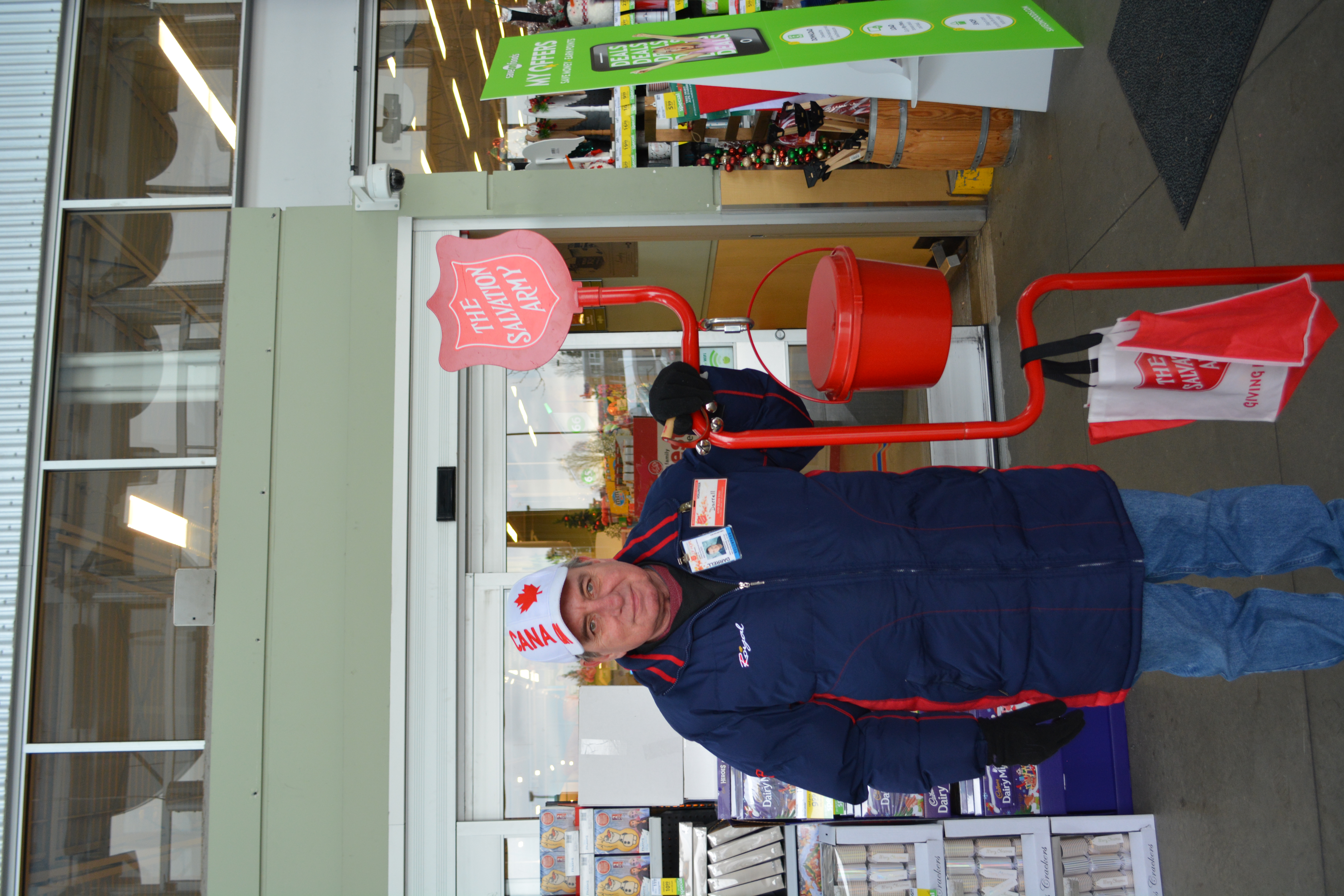 A Christmas Kettle volunteer smiling at the camera