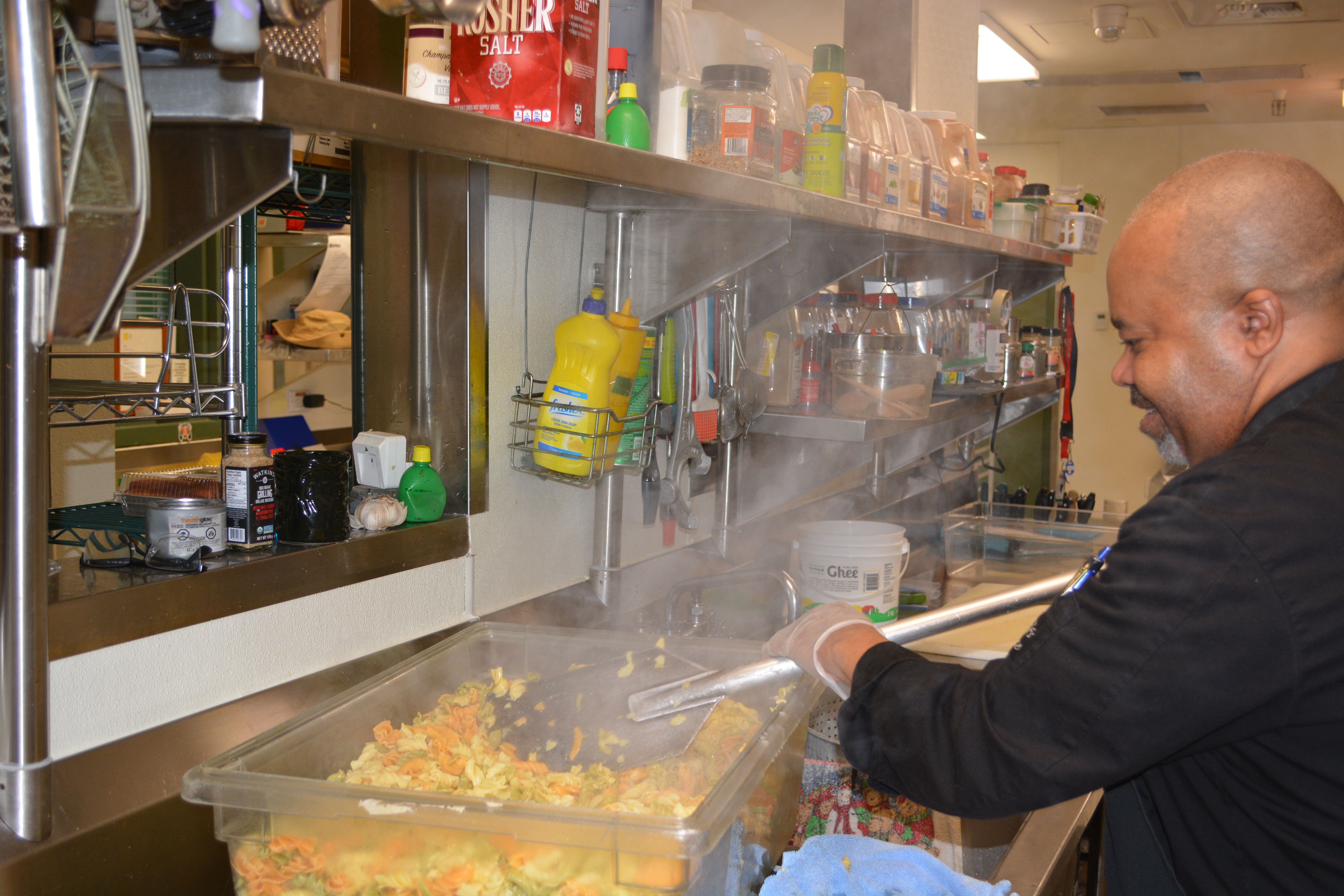 A male cooking in the kitchen